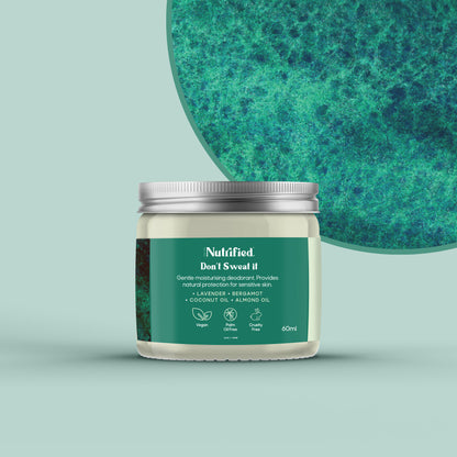 front view of Don't Sweat It jar with a green textured background