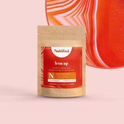 front view of Iron Up supplement pack with pink/red textured background