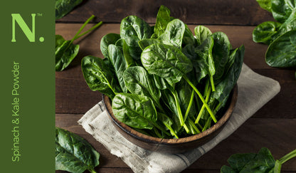 spinach in wooden bowl on top of tea towel on a wooden table - Kale & Spinach